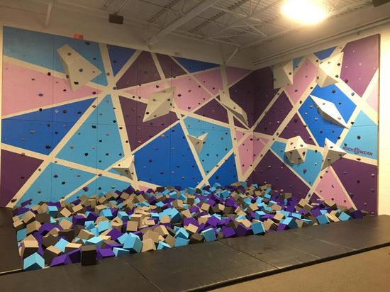 Altitude Trampoline Park, Indoor Rock Climbing Wall with Foam Pit.