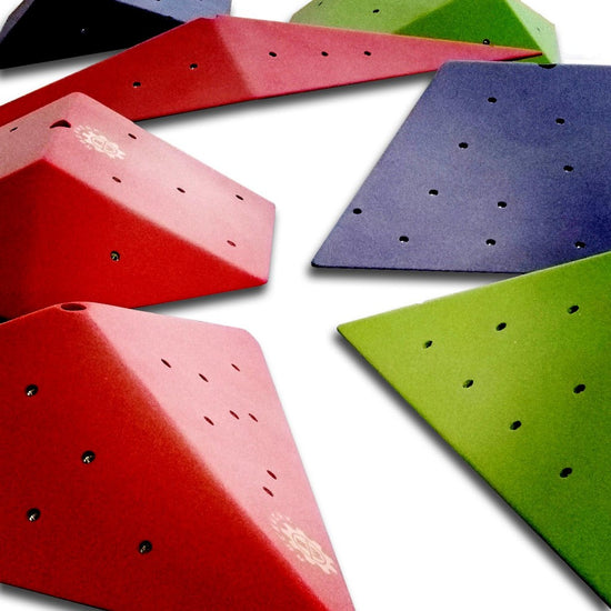 Rock climbing volumes used to add dimension to a climbing wall, multiple colors and coated in a durable and grippy climbing surface.