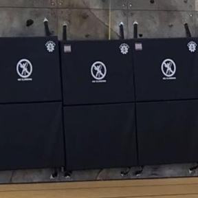 A closer look at the folding security mats used at the bottom of a flat climbing wall, often used for traverse walls.